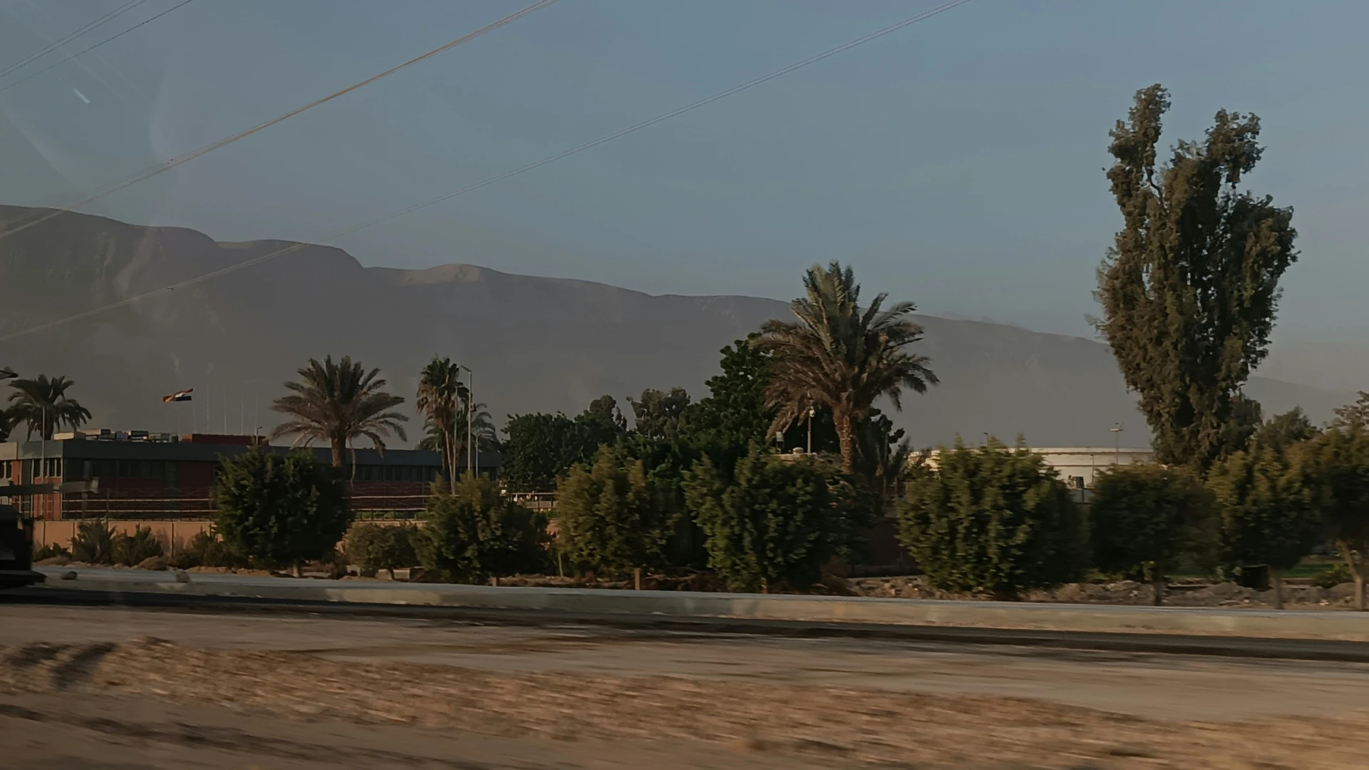 Ain Sokhna, Egypt - Road with trees and mountains in the background