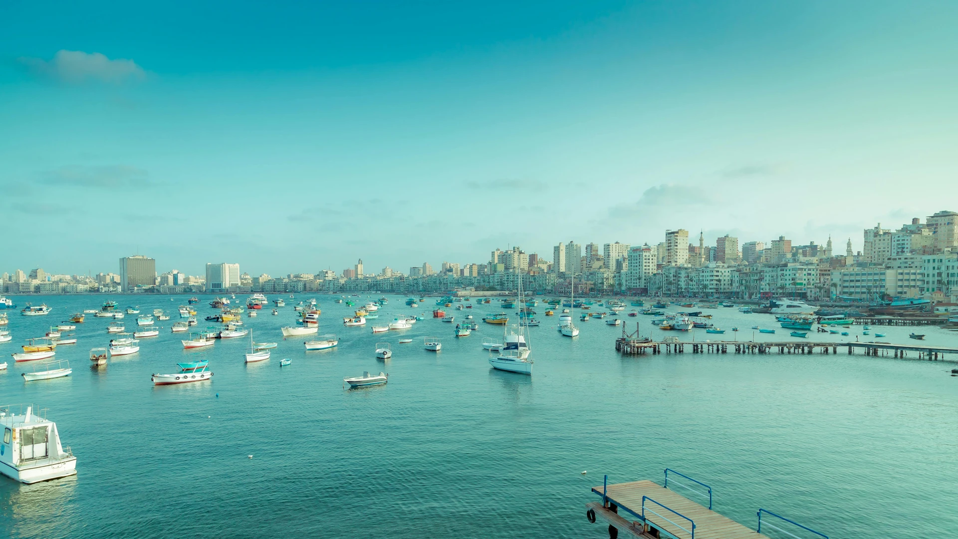 Alexandria, Egypt - Stunning view of alexandria's harbor featuring boats, piers, and the city skyline.