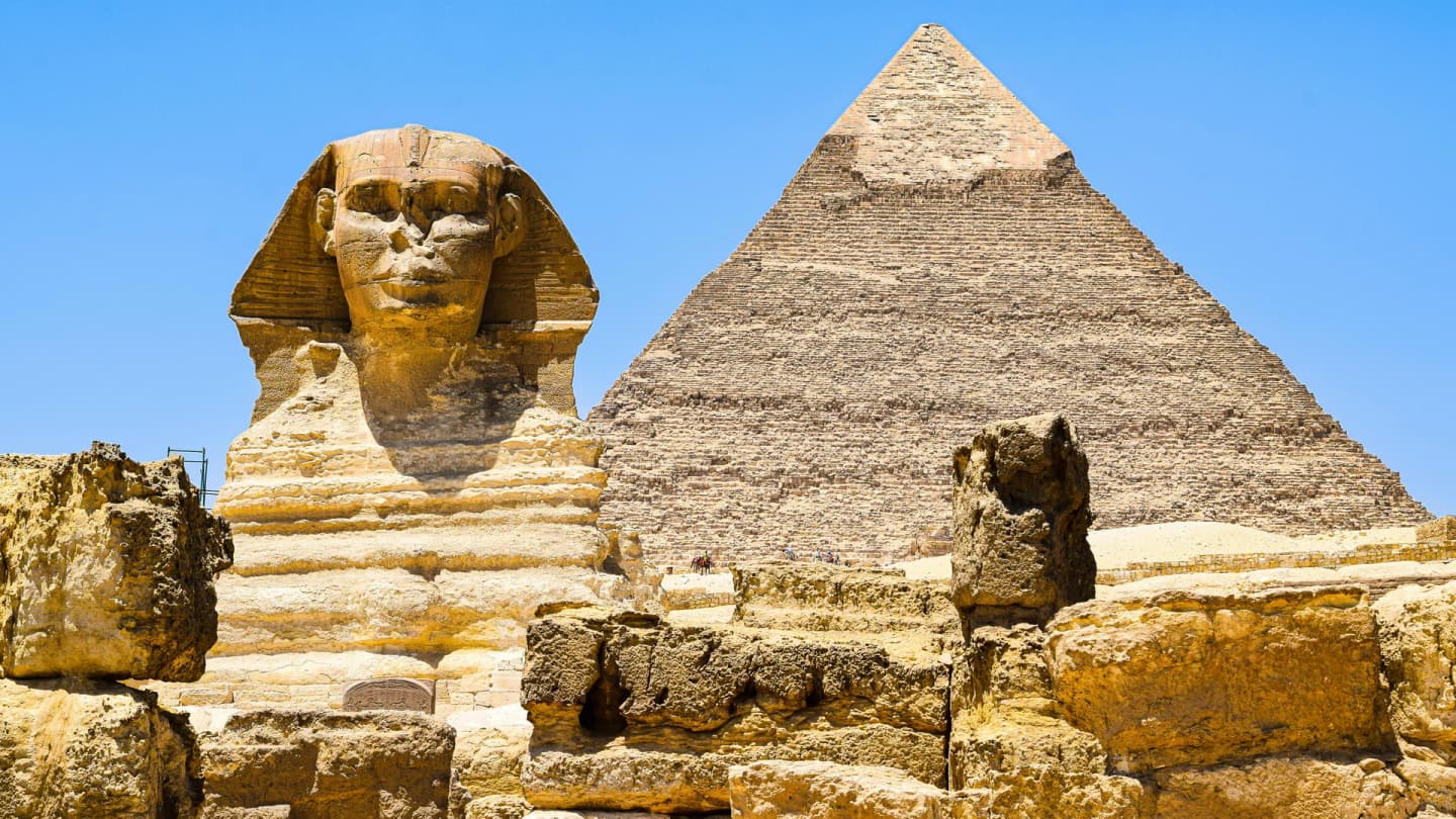 Dahab, Egypt - Magnificent view of the great sphinx and pyramid of khafre at giza, egypt under clear blue skies.