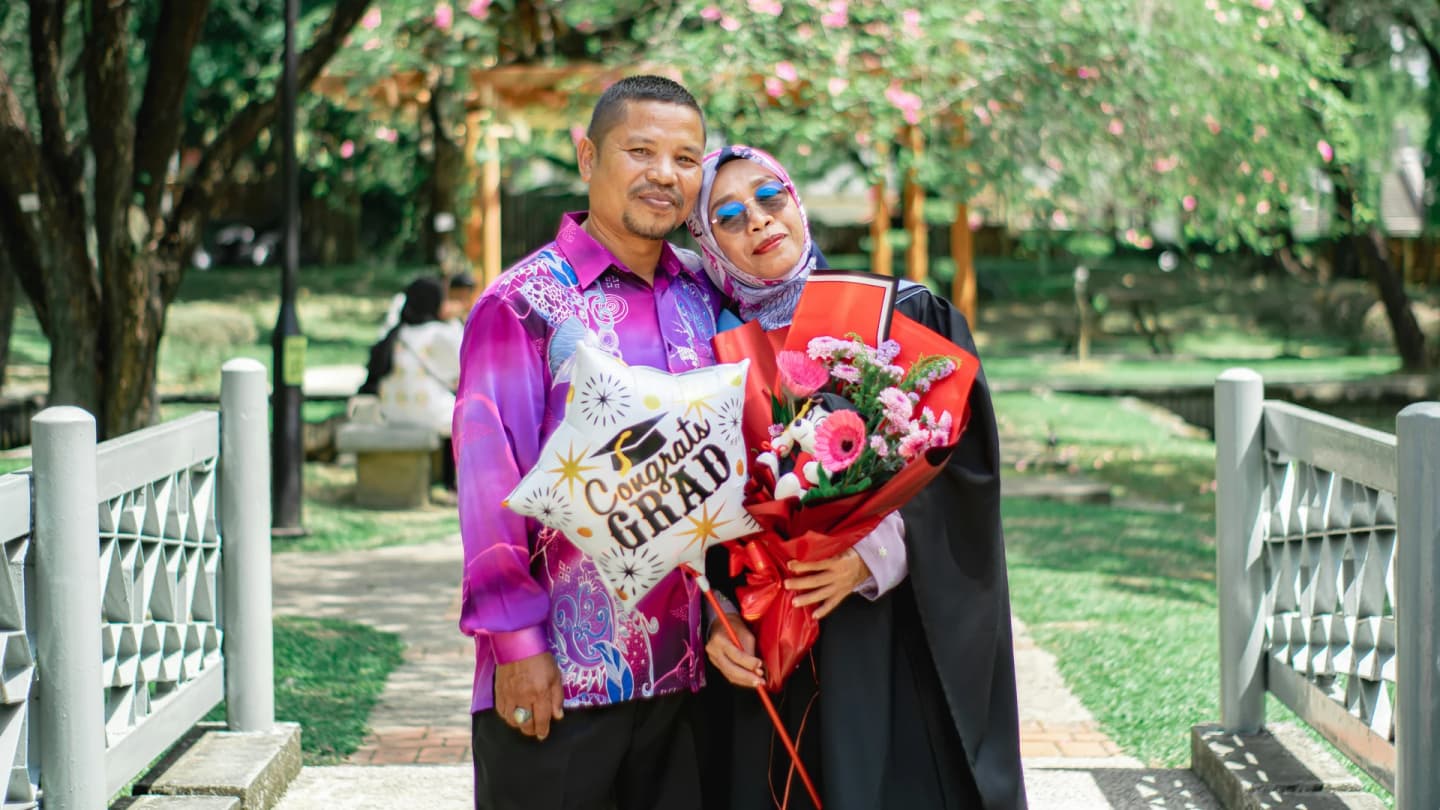 Marsa Alam, Egypt - Happy moment captured of a couple celebrating a graduation in shah alam park, malaysia.
