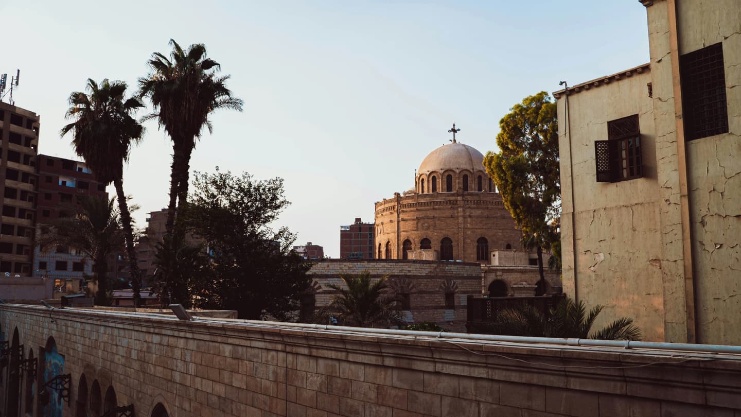 Safaga, Egypt - View of a building with a dome and palm trees