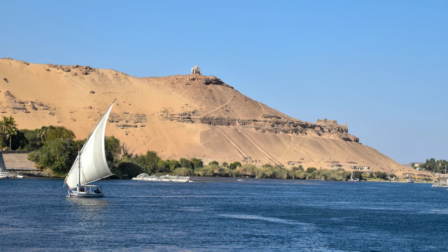 Safaga, Egypt - Sailboat in a body of water with a mountain in the background