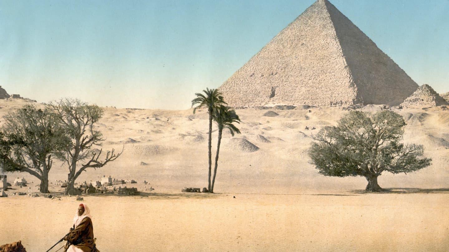 Safaga, Egypt - Resting bedouins and the grand pyramid, cairo, egypt