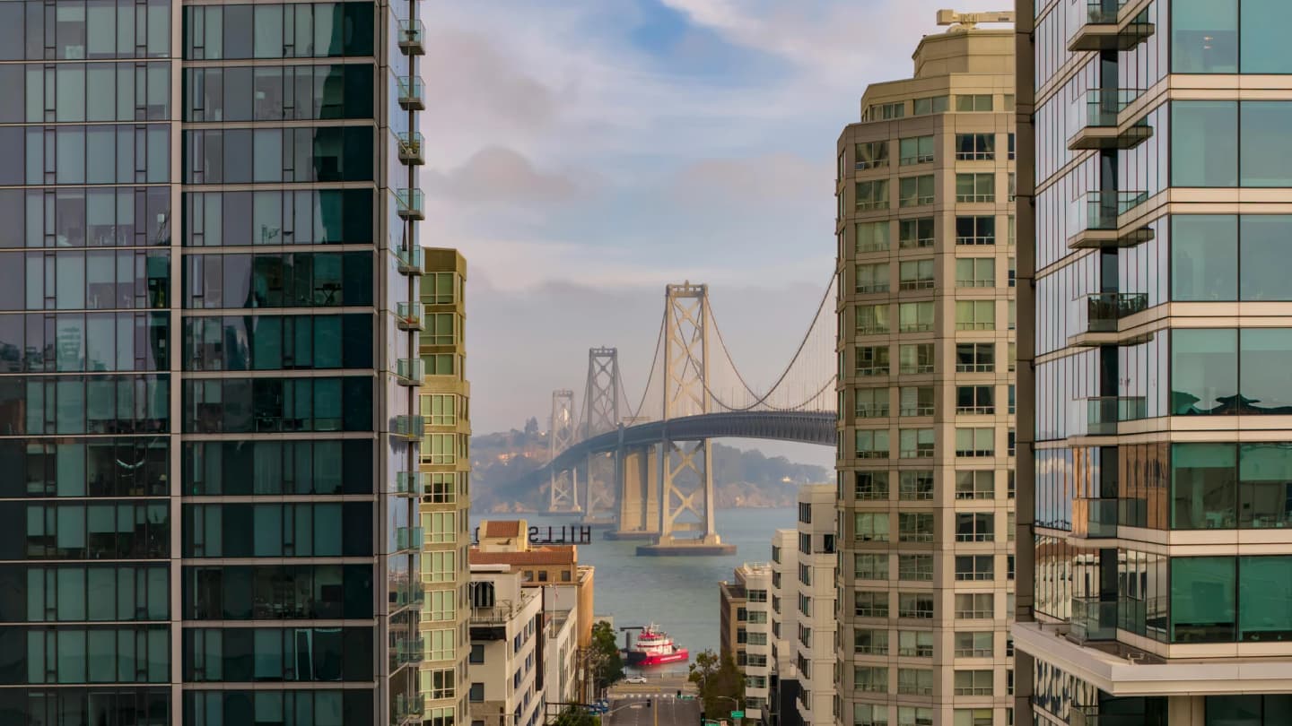Soma Bay, Egypt - Elevated view of san francisco's bay bridge framed by modern buildings capturing the city's urban charm.