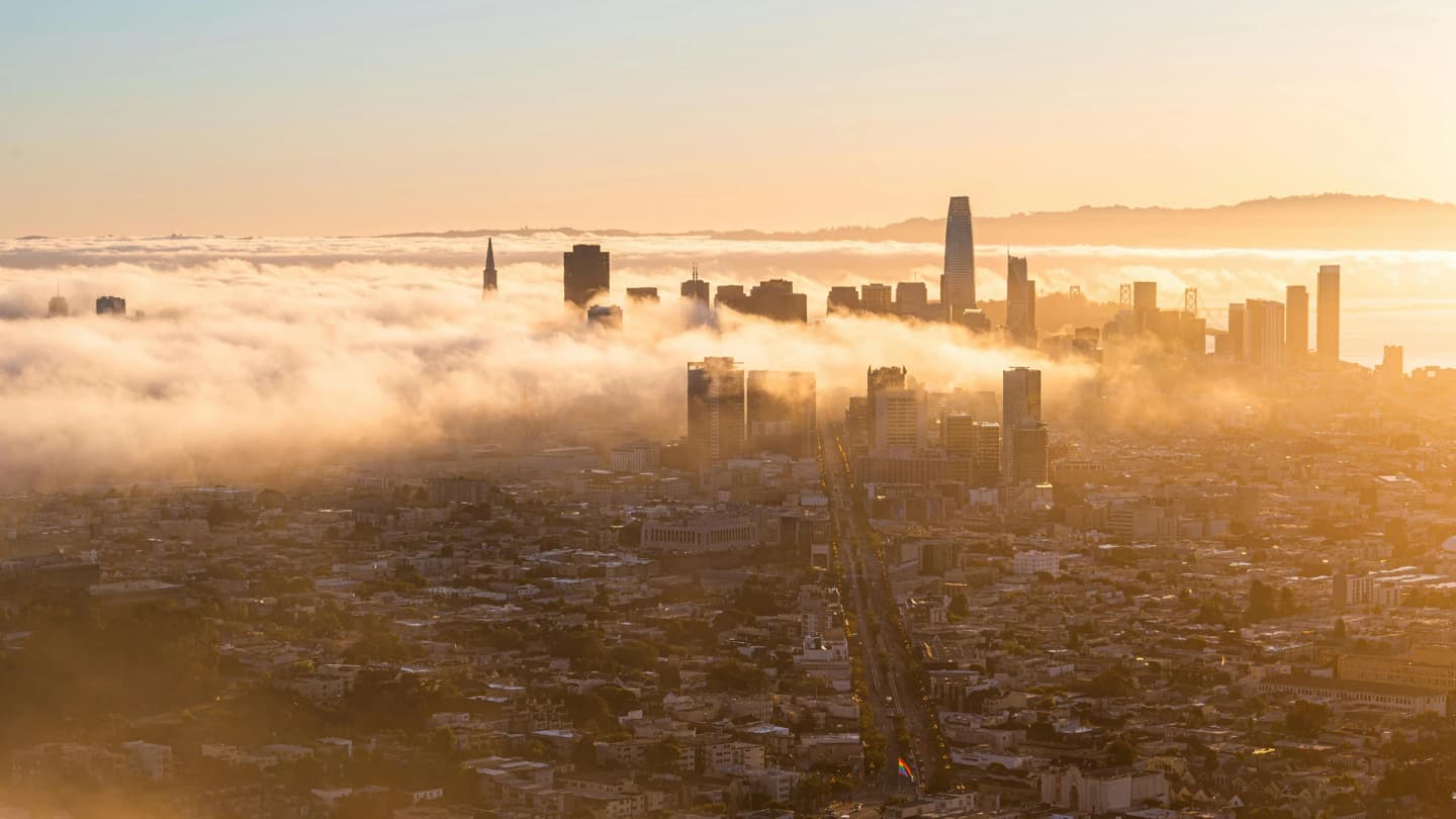 Soma Bay, Egypt - Aerial view of a foggy san francisco skyline at sunrise, highlighting iconic skyscrapers and urban landscape.