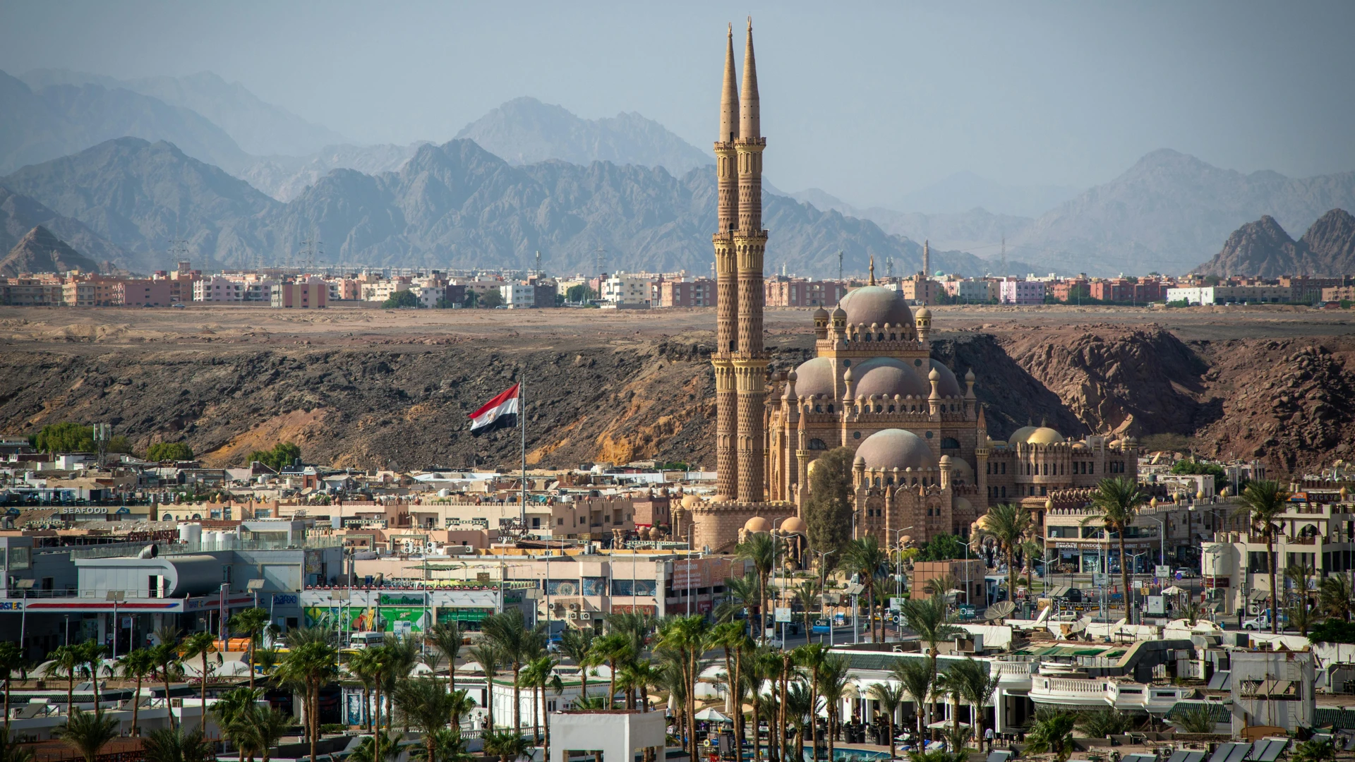 South Sinai, Egypt - Stunning aerial view of al sahaba mosque against sharm el sheikh cityscape and mountains.