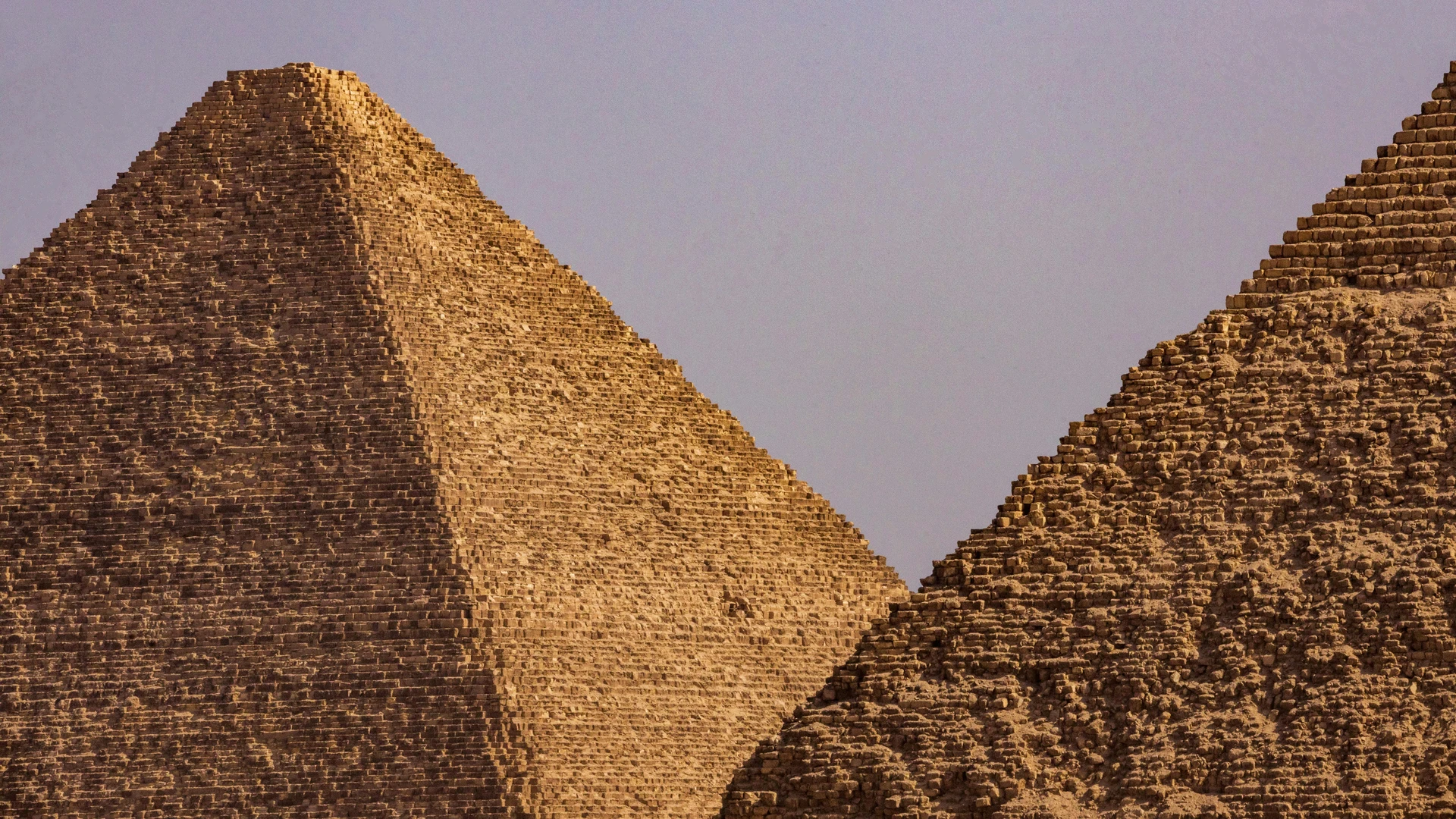 Sahl Hasheesh, Egypt - Close-up view of two iconic egyptian pyramids under a clear blue sky.