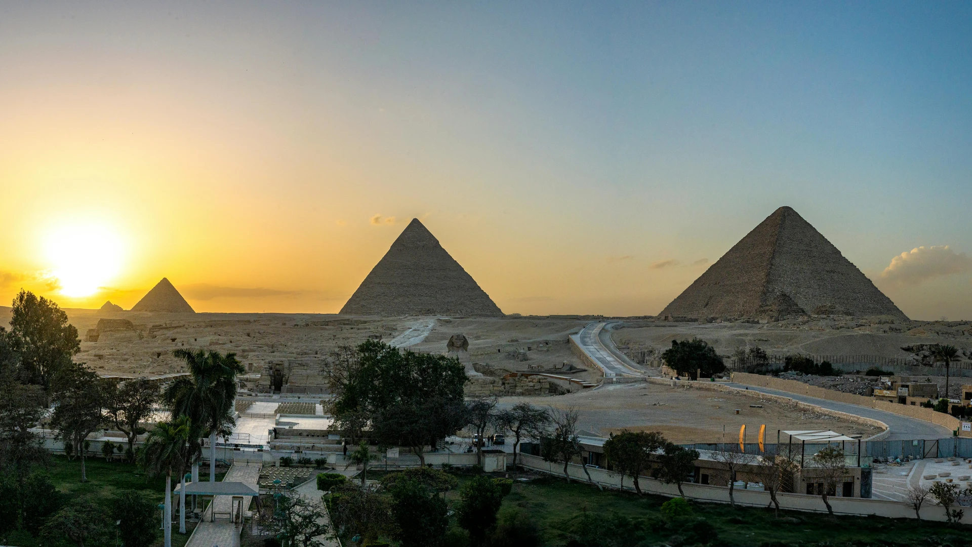 Sahl Hasheesh, Egypt - Breathtaking view of the pyramids of giza at sunset, capturing ancient history and stunning landscape.